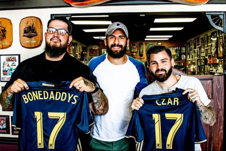 Bonedaddys Tattoo founder Jay Cunliffe (left), Philadelphia Union defender Richie Marquez (center) and tattooist Dan Czar.