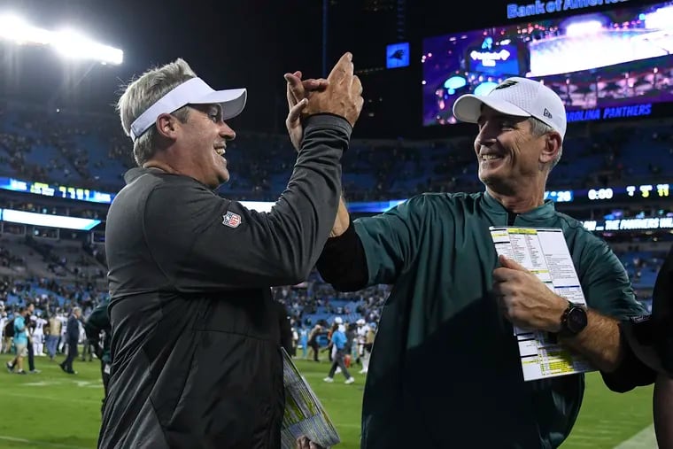 Eagles' head coach Doug Pederson (left) will have to overcome losing his offensive coordinator, Frank Reich.