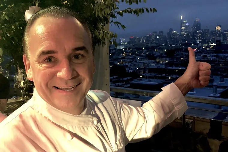 Jean-Georges Vongerichten at the Four Seasons "Pop-Down" event at Bok Bar on Sept. 25, 2018. He's pointing to the Comcast Technology Center in Center City, where he will operate a restaurant and lounge on the 59th and 60th floors.