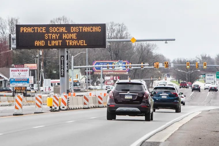 A PENNDOT sign along  Route 1 just below Street Road in Bucks County asking drivers to stay at home and practice social distance because of the coronavirus, on Sunday March 22, 2020.