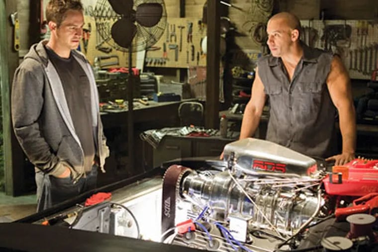 Vin Diesel (right) burns bright, but car pornography is the real star again in "Fast & Furious," the latest installment in the gas-powered franchise. (AP Photo / Universal Pictures, Jaimie Trueblood)