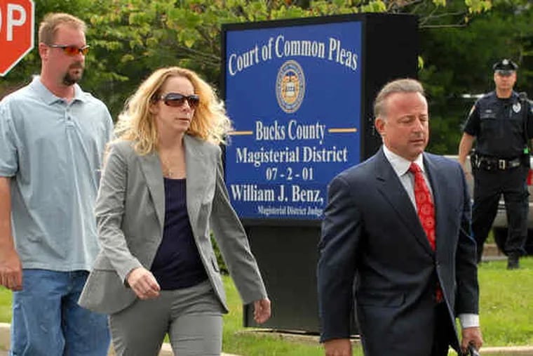 Bonnie Sweeten arrives at District Court in Richboro for a preliminary hearing. She was accompanied by her husband, Larry (left), and lawyer Louis Busico. The Bucks County woman whose kidnapping hoax causeda national media frenzy in May waived yesterday's hearing. Story, B3.