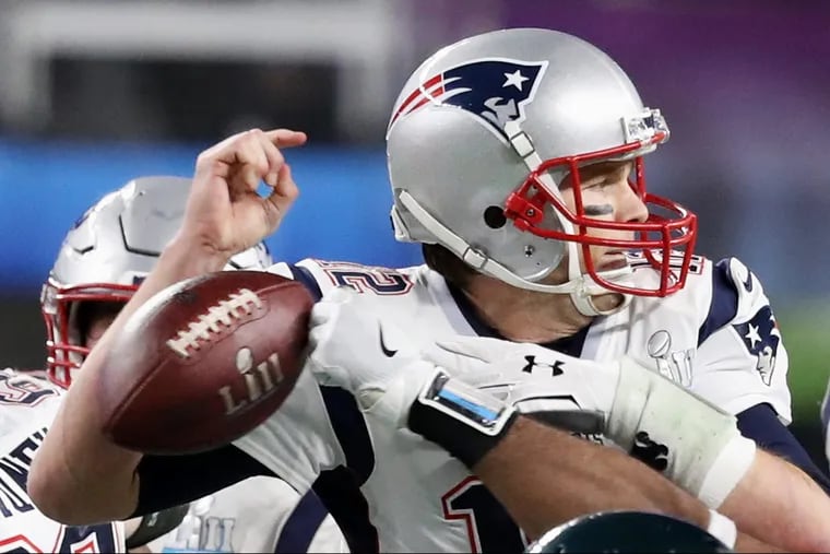 Eagles defensive end Brandon Graham knocks the ball away from Tom Brady in the fourth quarter of Super Bowl LII.