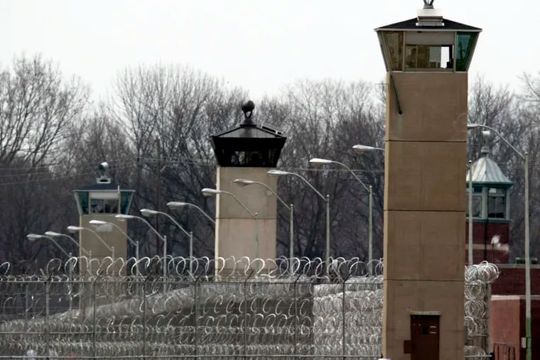 In a file photo from March 17, 2003, guard towers and razor wire ring the compound at the U.S. Penitentiary in Terre Haute, Ind., the site of the last federal execution. Democratic presidential candidates may have a delicate balancing act when dealing with the Justice Department's announcement that it will begin executing federal death row inmates for the first time since 2003. The Democratic Party is more unified in its opposition to capital punishment than in years past, but a majority of Americans continue to support the death penalty.