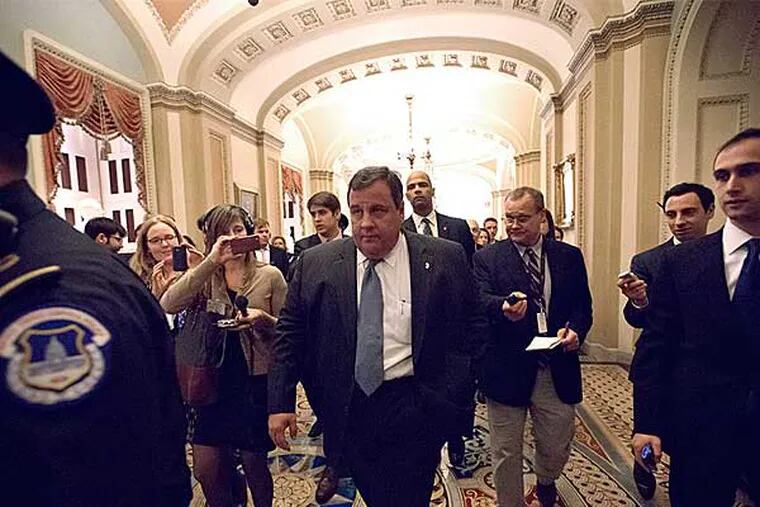 Gov. Christie walks to a meeting on Capitol Hill on Thursday. Christie is in Washington to discuss aid to help his state recover from Superstorm Sandy. President Obama is expected to ask Congress for about $50 billion in additional emergency assistance. (J. Scott Applewhite / Associated Press)