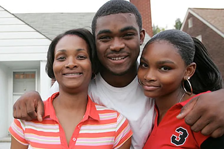 Brandon Graham with his mother, Tasha, and sister, Brittany, at their Detroit home in 2005. (Kirthmon F. Dozier/Detroit Free Press)