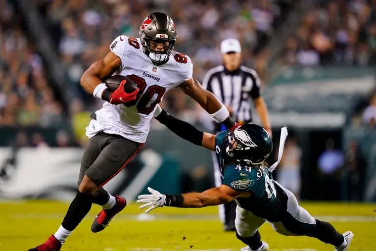 Tampa Bay Buccaneers tight end O.J. Howard (80) runs with the ball past Philadelphia Eagles outside linebacker Alex Singleton (49) during the first half of an NFL football game Thursday, Oct. 14, 2021, in Philadelphia. (AP Photo/Matt Rourke)