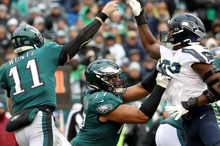 The Eagles'  Andre Dillard (77)  blocking Seattle's Rasheem Green, in the Eagles' loss to Seattle in November.