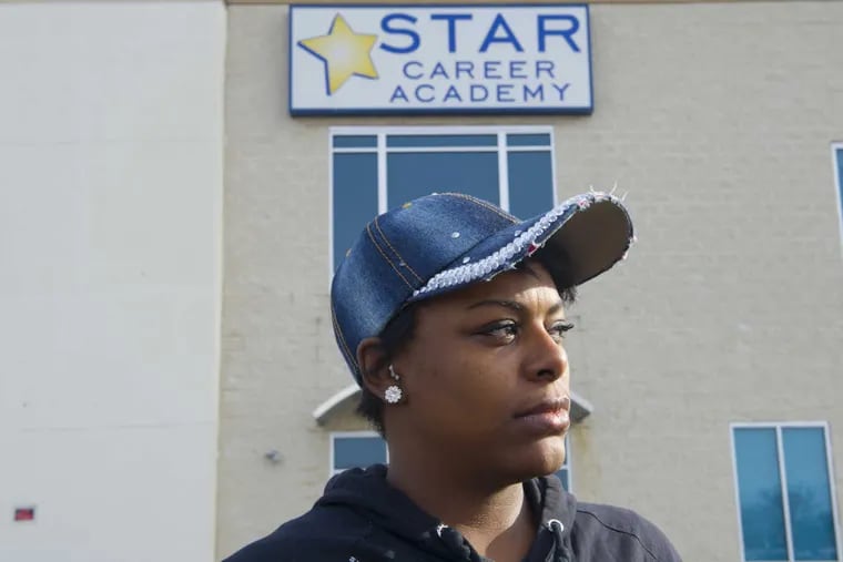 Latoya Cobb stands in front of the now-shuttered Star Career Academy in Northeast Philadelphia. The for-profit education company shut down without warning on Nov. 15.