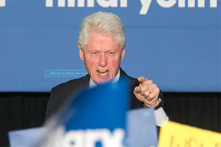 Former President Bill Clinton gets into a heated exchange with a protester at the Dorothy Emanuel Recreation Center in East Mount Airy on Thursday, April 7.