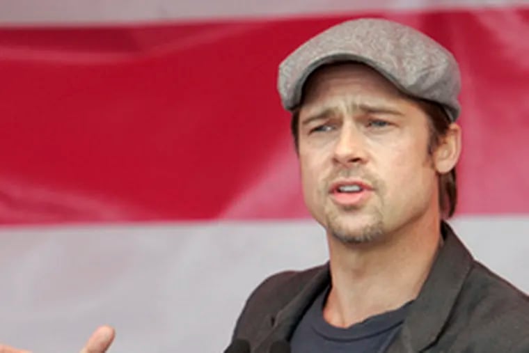 Brad Pitt announces he&#0039;ll help build at least 150 affordable, ecofriendly homes in New Orleans&#0039; Ninth Ward. (&quot;Brad the Builder.&quot;)