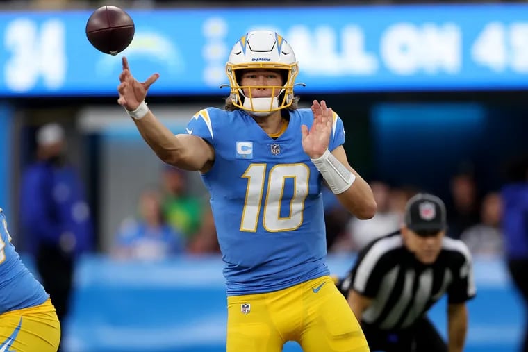 Los Angeles Chargers quarterback Justin Herbert throws a pass downfield during a game against the Denver Broncos at SoFi Stadium. (Photo by Sean M. Haffey/Getty Images)