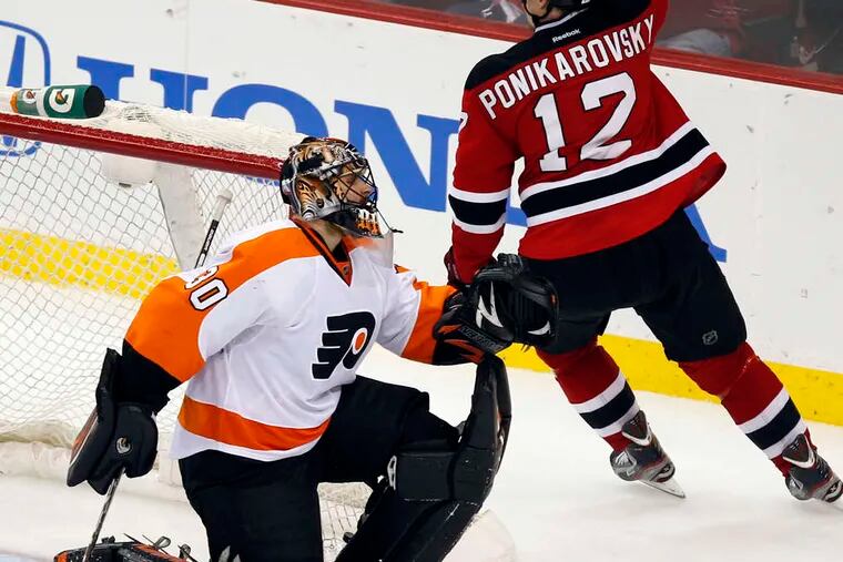 Alexei Ponikarovsky celebrates overtime goal that beat Flyers goalie Ilya Bryzgalov and gave Devils a 2-1 series lead.