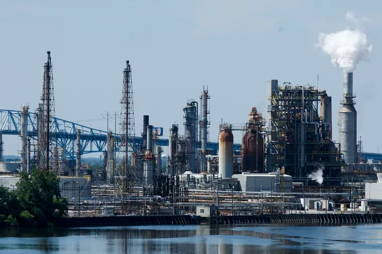 FILE photo shows the Philadelphia Energy Solutions refinery complex in Philadelphia. The company will retain 83 union workers as “caretakers” at its shuttered refining complex after August 25, the last official day for most employees.