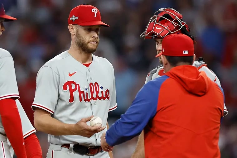 Phillies starter Zack Wheeler hands the ball to manager Rob Thomson as he exits the game in the seventh inning.