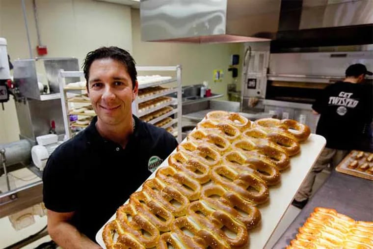 Dan DiZio, CEO of the Philly Pretzel Factory with a tray of fresh baked pretzels on April 23, 2012. (File photo: David M Warren / Staff Photographer)