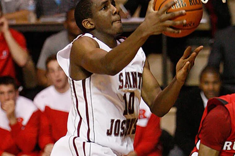 St. Joseph's Langston Gallaoway lays the ball up in the first half against Rutgers. (Ron Cortes / Staff Photographer)