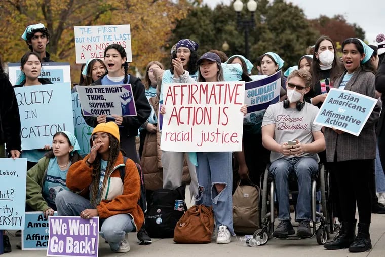 People rally outside the Supreme Court as the court begins to hear oral arguments in two cases that could decide the future of affirmative action in college admissions on Monday.