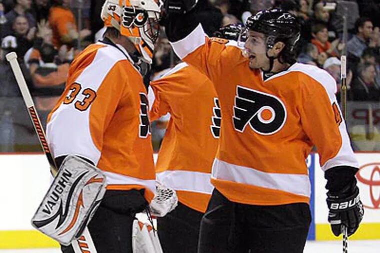 "I'm confident in our team because it doesn't seem to matter where we play," Danny Briere (right) said. (Yong Kim/Staff file photo)