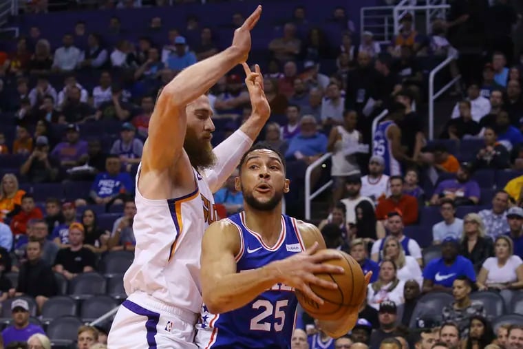 Ben Simmons (25) was guarded by Suns center Aron Baynes this game. The All-Star point guard finished with six points on 2-for-8 shooting in the 76ers' first loss of the season.