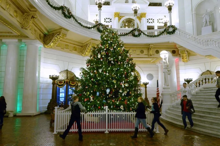 The 22-foot-tall Douglas fir in the Capitol rotunda is hung with ornaments solicited by the state Department of Aging through local agencies and senior centers.