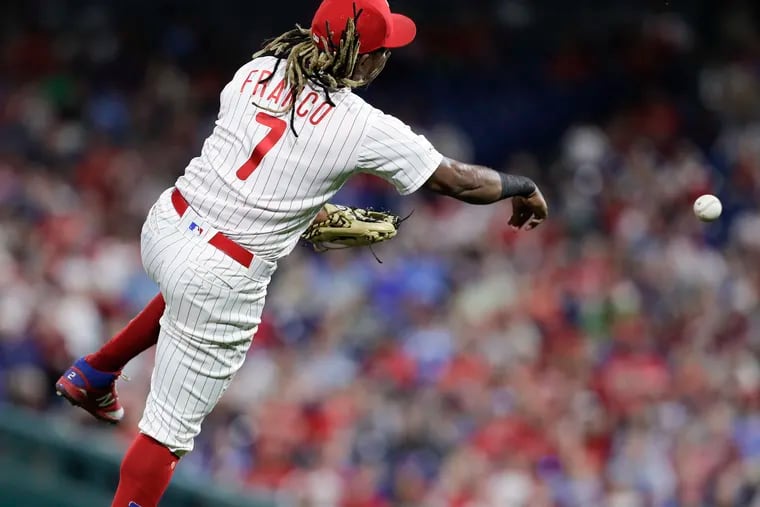 Third baseman Maikel Franco moves to throw Kurt Suzuki out at first in the seventh inning of the Phillies' 4-3 win Monday against Washington.