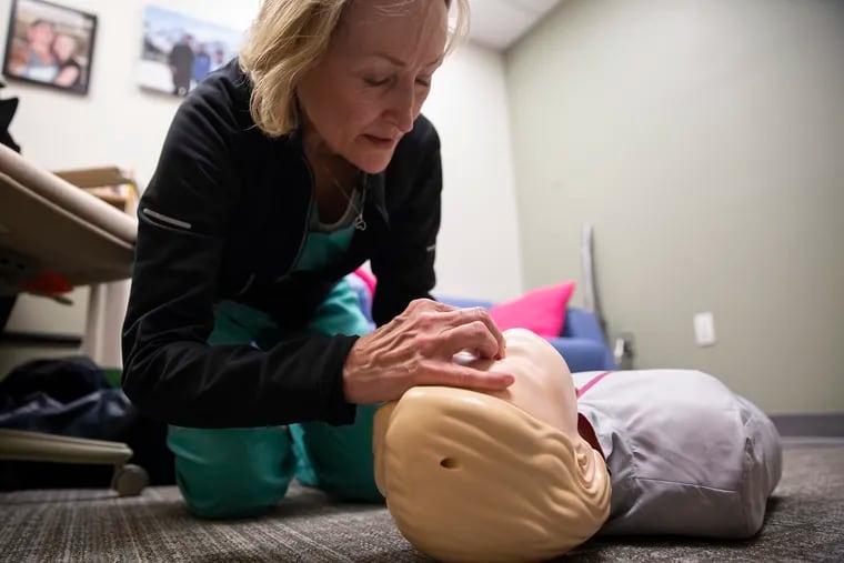Dr. Bonnie Milas, an anesthesiologist at Penn, demonstrates how to administer Narcan nasal spray on a mannequin in her office at the Hospital of the University of Pennsylvania.