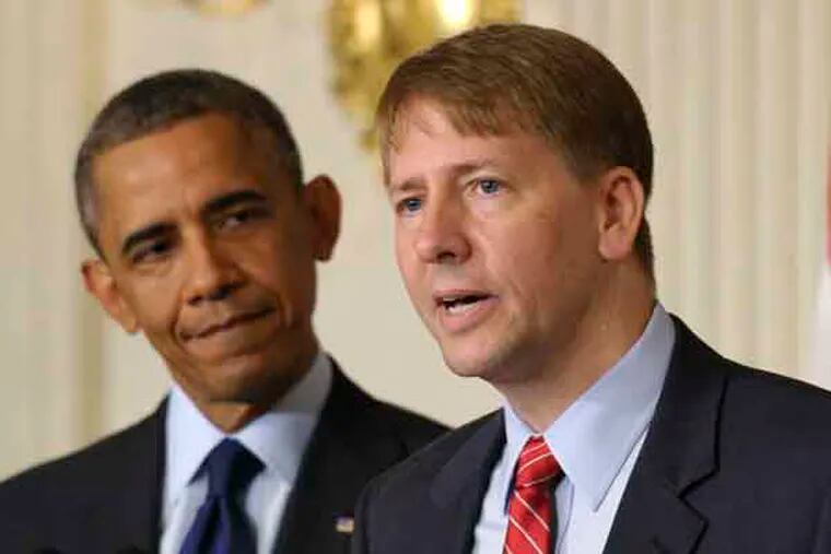 President Barack Obama, left, listens as Richard Cordray, right, the new director of the Consumer Financial Protection Bureau, speaks in the State Dining Room of the White House in Washington, Wednesday, July 17, 2013. The Senate voted on Tuesday, July 16, 2013, to end a two-year Republican blockade that was preventing Cordray from winning confirmation as director of the Consumer Financial Protection Bureau. (AP Photo/Susan Walsh)