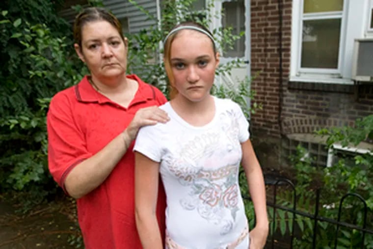 Kathleen Walker (left) & daughter Samantha, grill-thief victims.