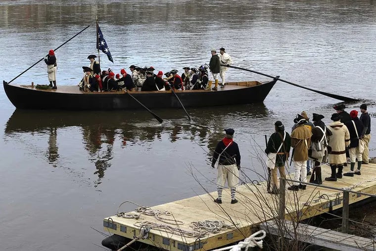 A boat chugs along the Delaware River on its way from Pennsylvania to New Jersey during the 61st annual re-enactment of Washington's daring Christmas 1776 crossing of the river, the trek that turned the tide of the Revolutionary War, in Washington Crossing, N.J., on Wednesday, Dec. 25, 2013. During the crossing 234 years ago, boats ferried 2,400 soldiers, 200 horses and 18 cannons across the river, and the troops marched eight miles downriver before battling Hessian mercenaries in the streets of Trenton. (AP Photo/Julio Cortez)