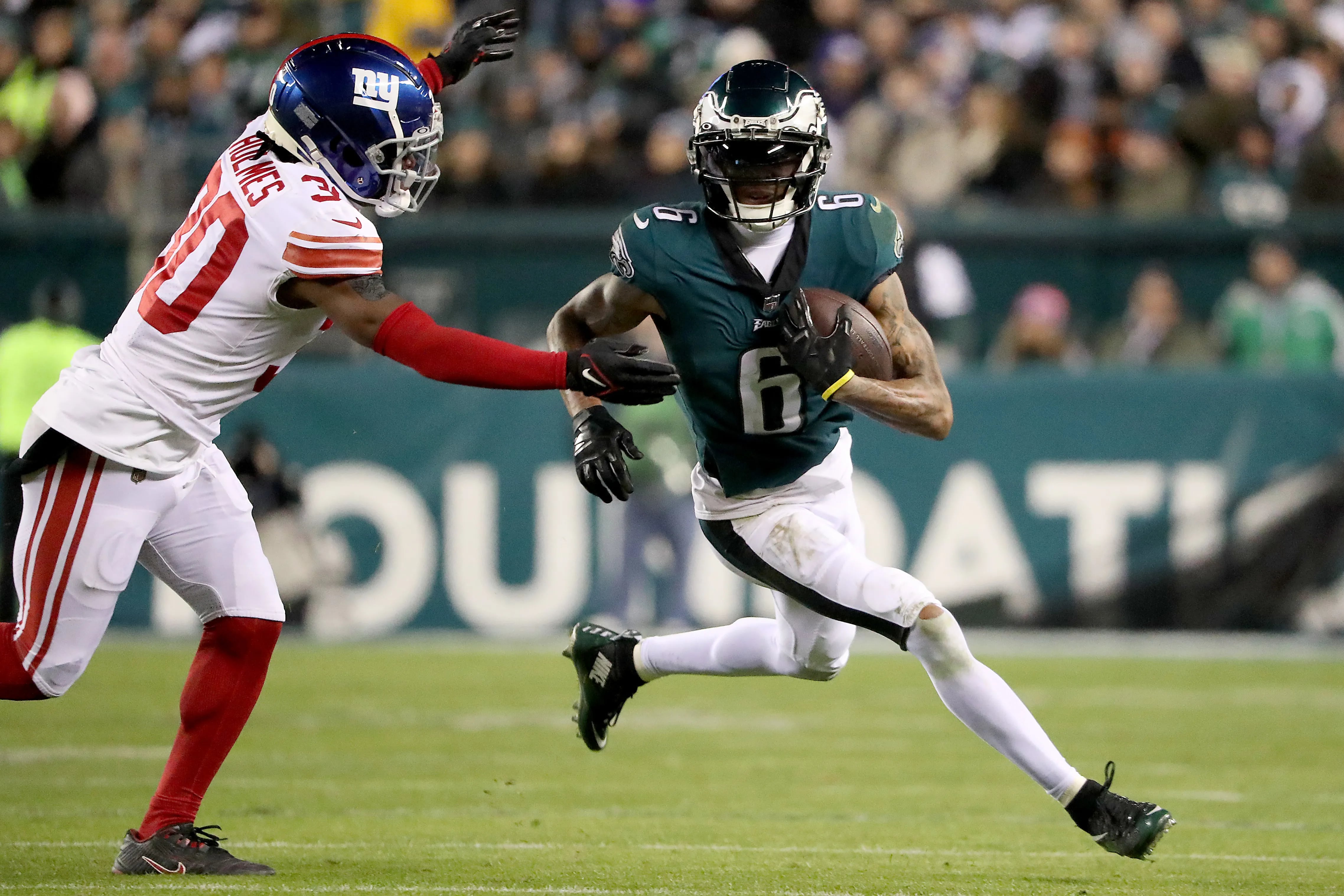 Philadelphia Eagles wide receiver DeVonta Smith makes a play against New York Giants cornerback Darnay Holmes during last season's NFC divisional playoff game at Lincoln Financial Field.