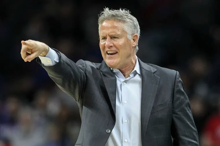 Brett Brown, left, has stepped down as Australia's coach in the Olympics.