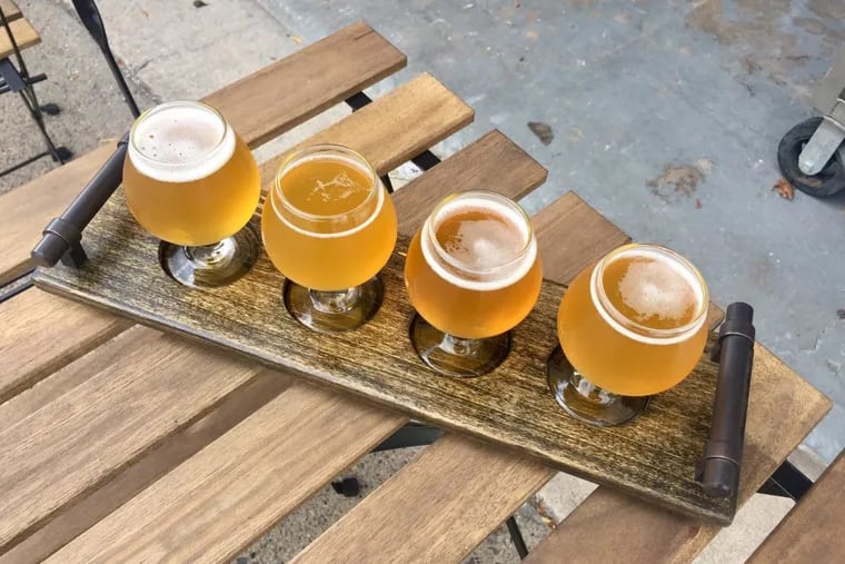 A flight of beers at Brewery ARS on West Passyunk Avenue.