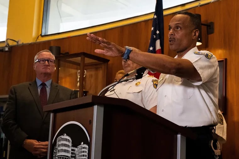 As Mayor Jim Kenney looks on at left, Philadelphia Police Commissioner Richard Ross announces that 13 officers will be fired over racist or offensive Facebook posts during a news conference at Police Headquarters in Philadelphia on Thursday, July 18, 2019.
