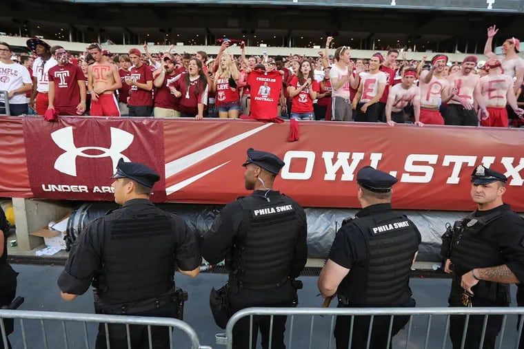 Fan and police prepare for a Temple defeat Penn State 27-10 during Penn State at Temple at Lincoln Financial Field Saturday September 5, 2015.