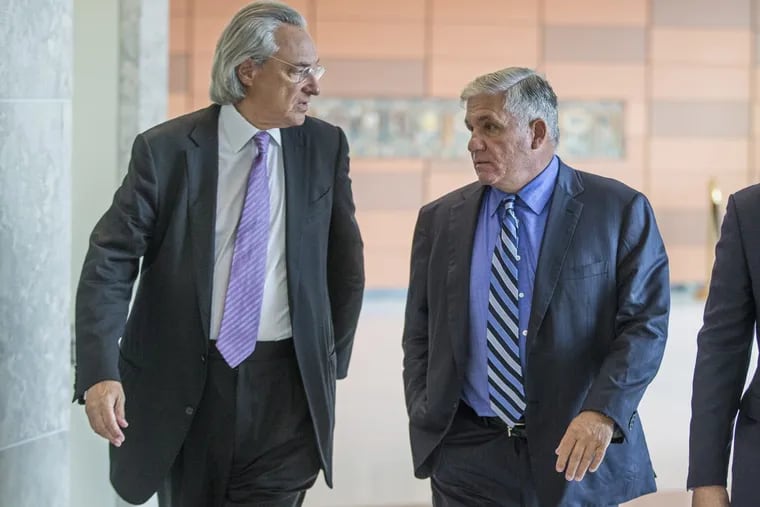 Attorney Thomas R. Kline (left), representing the Finocchiaro family, speaks wth Robert Mongeluzzi,  representing another family whose son was allegedly killed by Cosmo DiNardo.