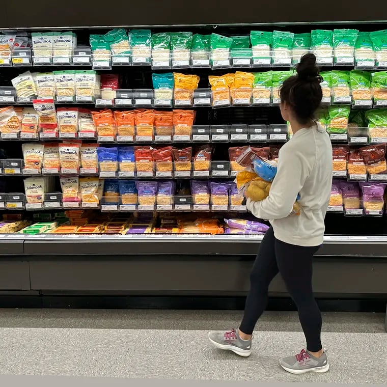 A shopper peruses the refrigerated offerings in a Target store in Sheridan, Colo.