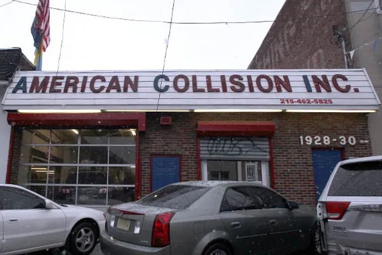 South Philly's American Collision, which works on police cars, is owned by an ex-con, sentenced to three years for turning another shop he owned into what prosecutors called a &quot;shop of fraud.&quot; He's also under investigation for insurance fraud. (Yong Kim/Staff Photographer)