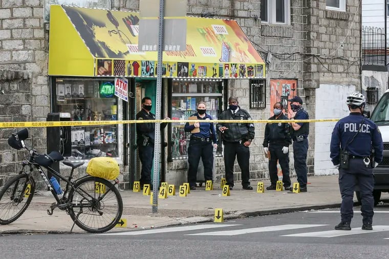 Philadelphia Police investigate a homicide scene at 65th and Dicks in the 12th Police District. Police said a 17-year-old male was shot multiple times.