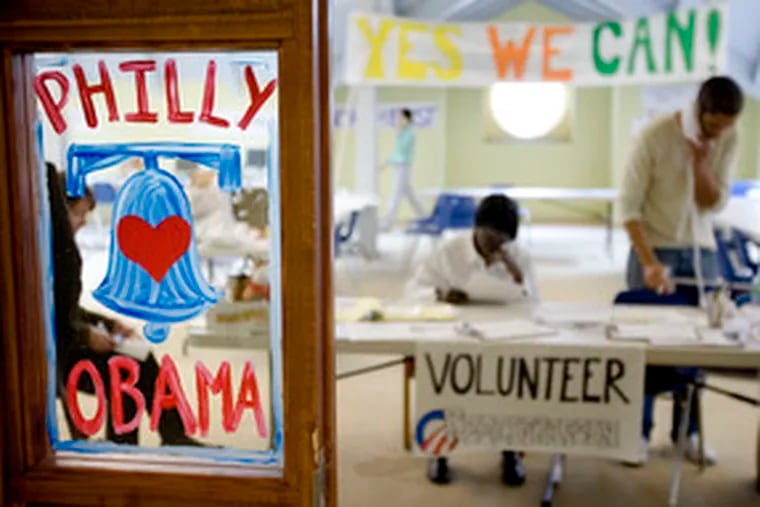 Barack Obama workers handle the phones at the candidate&#0039;s Philadelphia campaign office, where a hand-painted sign decorates the door.