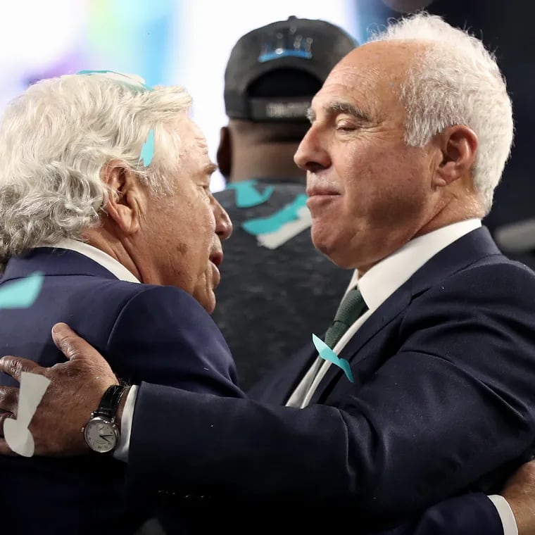 Patriots owner Robert Kraft, left, talks with Eagles owner Jeffrey Lurie after the trophy ceremony after Super Bowl LII, at U.S. Bank Stadium in Minneapolis, Minnesota, Sunday, Feb. 4, 2018. The Eagles won 41-33. TIM TAI / Staff Photographer 