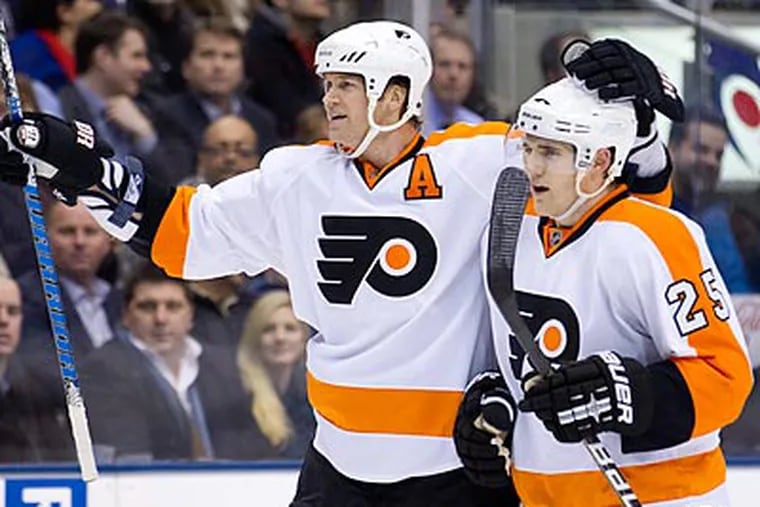 Chris Pronger, left, could miss time with a foot injury. (AP Photo/The Candian Press, Frank Gunn)
