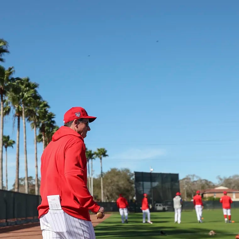 Phillies manager Rob Thomson takes the field on Feb. 14 at BayCare Ballpark for the first day of spring training in Clearwater, Fla.