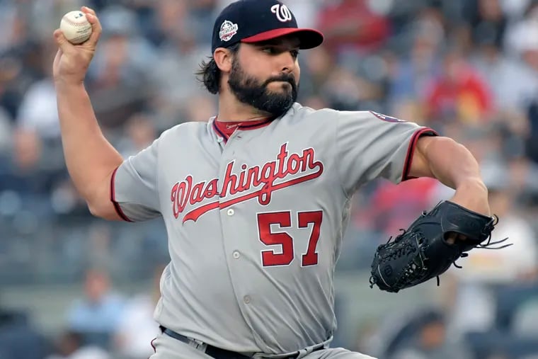 FILE - In this Tuesday, June 12, 2018 file photo, Washington Nationals pitcher Tanner Roark delivers the ball to a New York Yankees batter during the first inning of a baseball game at Yankee Stadium in New York. The Washington Nationals have traded Tanner Roark to the Reds for another right-hander named Tanner, less proven Tanner Rainey. Washington boosted its rotation by signing Patrick Corbin to a $140 million, six-year contract last week. The Nationals went 82-80 and finished second in the NL East behind Atlanta and missed the playoffs following two straight trips and defeats in the NL division series. (AP Photo/Bill Kostroun, File)