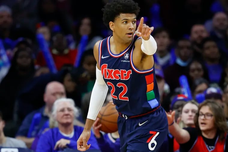 Sixers guard Matisse Thybulle points after a stop against the Detroit Pistons on Sunday, April 10, 2022 in Philadelphia.