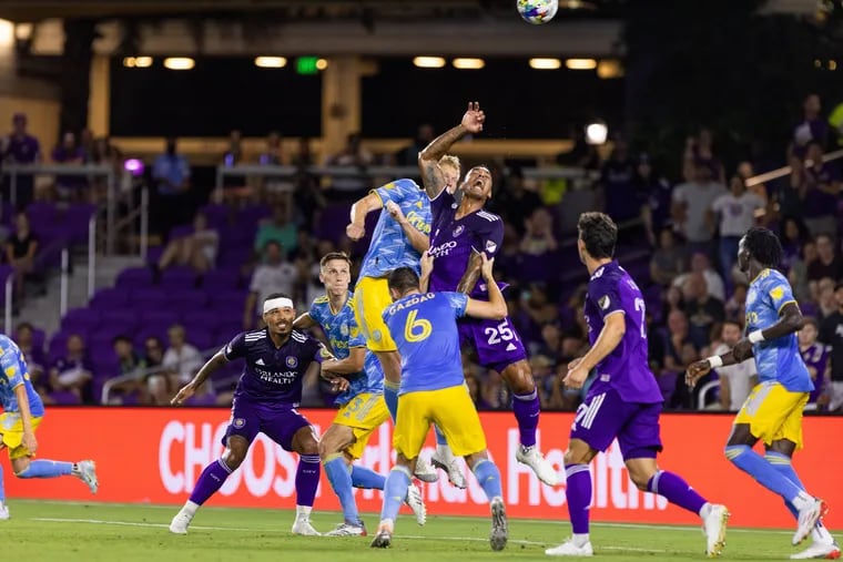 One of the many pileups between players in the Union's win at Orlando City.