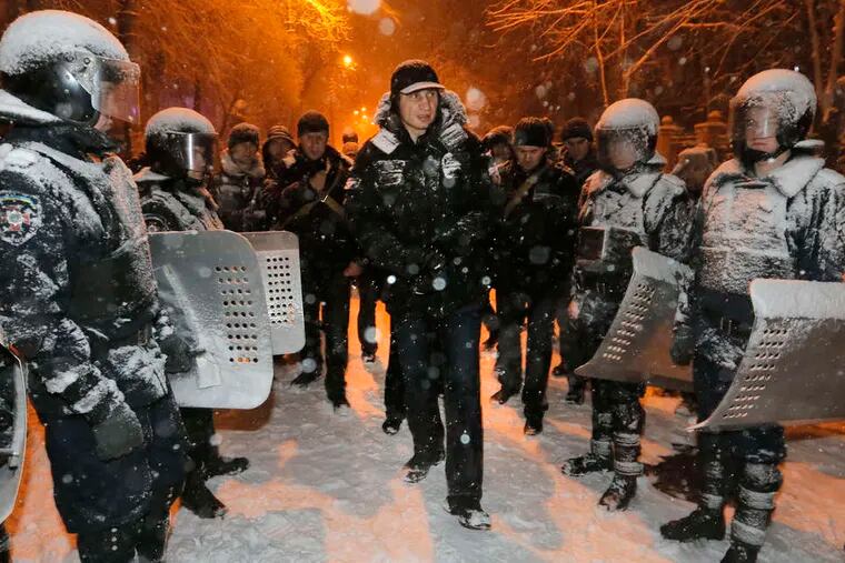 Heavyweight boxing champion Vitali Klitschko, a Ukrainian lawmaker and opposition leader, attempts to head off clashes between police and pro-European Union activists in Kiev.