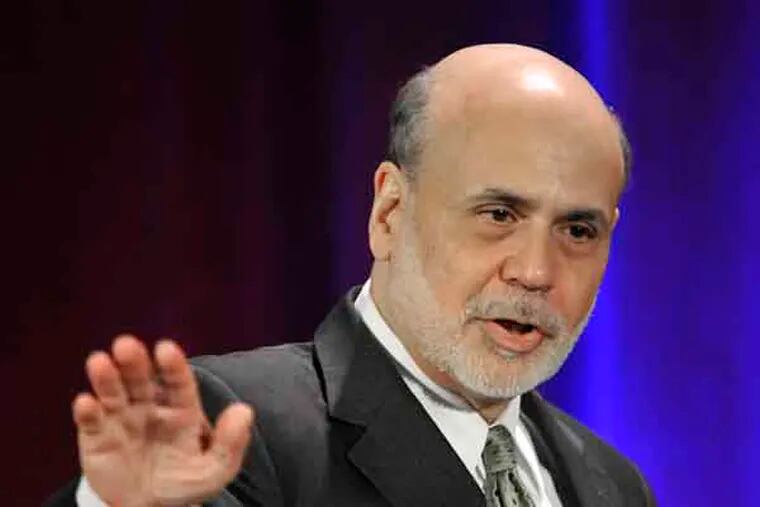 Federal Reserve Chairman Ben Bernanke waves goodbye after speaking during a banking conference in Chicago, Friday, May 10, 2013. The Federal Reserve has broadened its oversight beyond banks and now monitors a wide-range of financial institutions that could hasten another financial crisis, Bernanke said Friday. (AP Photo/Paul Beaty)