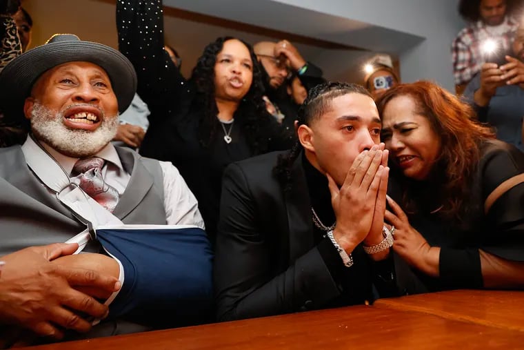 Paulsboro native Seth Lundy reacts with his parents Gerald Lundy (left) and Martina Lundy after being drafted 46th by the Atlanta Hawks in the 2023 NBA Draft at the Empire Sports Bar in Brooklawn, New Jersey on June 22.