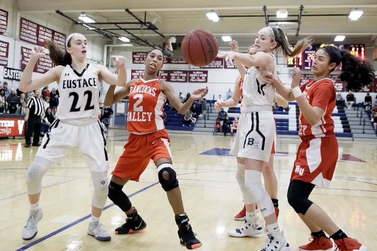 Bishop Eustace's Kaitlyn Deiter (22) and Lauren Punk battle Rancocas Valley's Kylie Bradford (2) and Adriana Agosto for a loose ball in the first half.